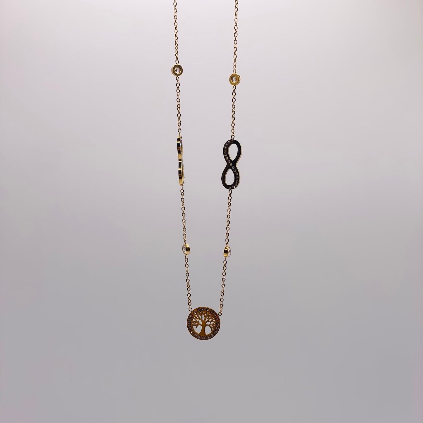 Coller acier jaune motif arbre de vie et signe infini pierres serties clos