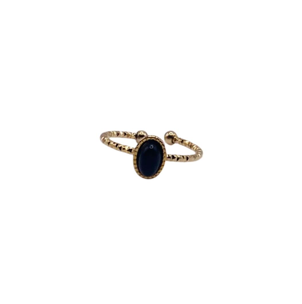 Bague acier jaune avec pierre noire ovale